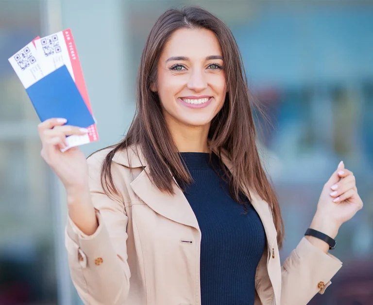 A girl waving canada ticket